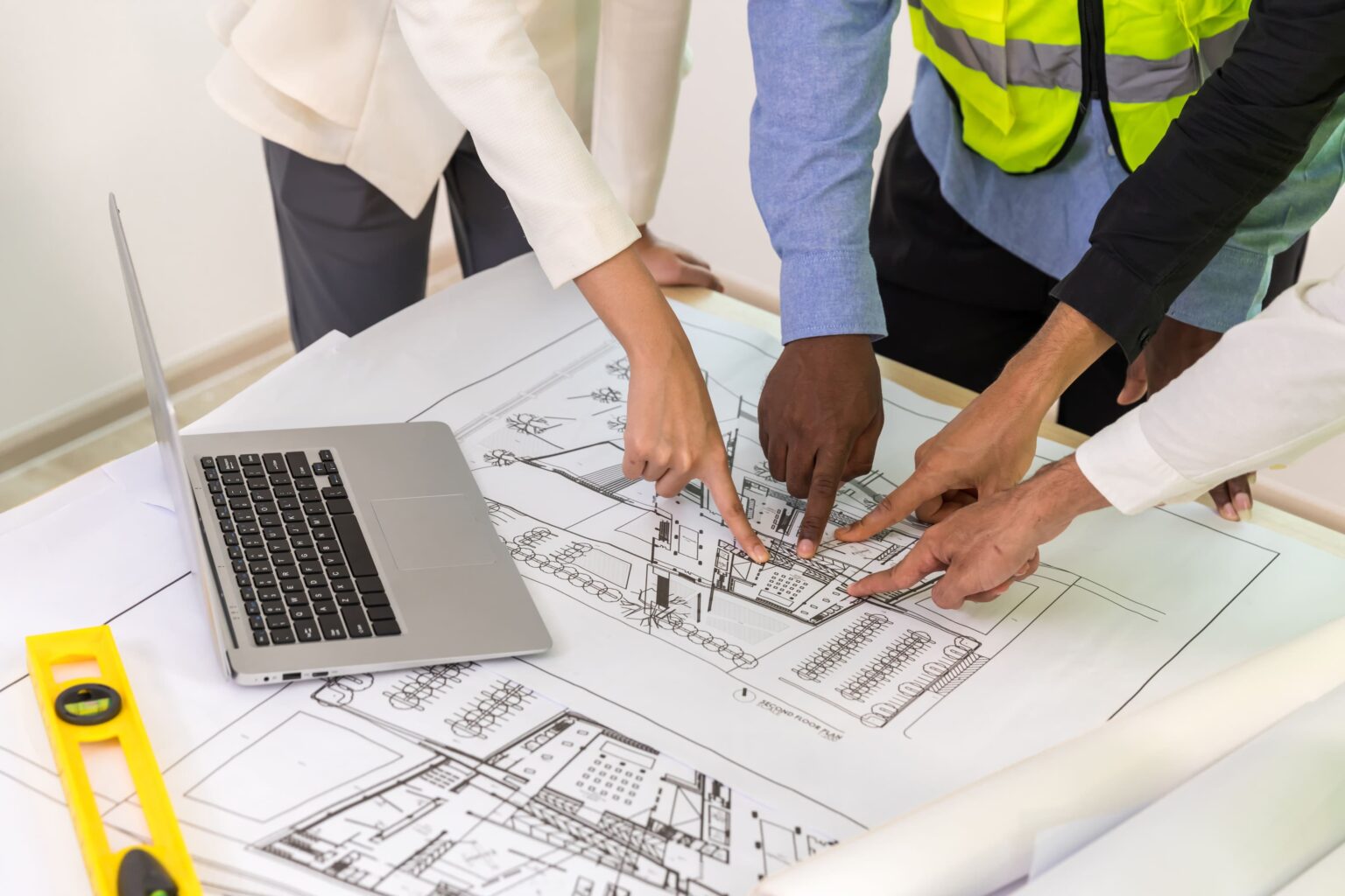 engineers-with-draft-plan-of-building-on-construct-2025-03-18-14-05-12-utc